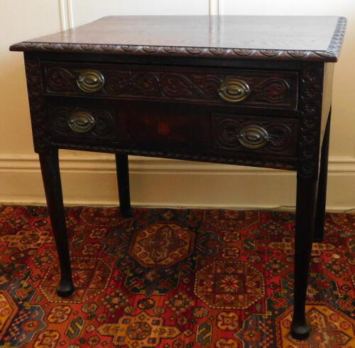 An 18thC oak side table, with later demi-lune carving having an arrangement of three frieze drawers, turned legs and pad feet, 82cm wide, 56cm deep.