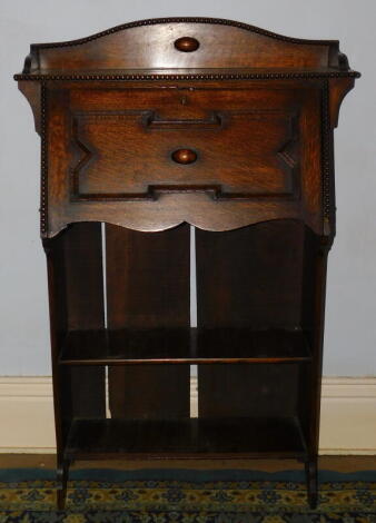 A 1930's oak student's bureau, with fall flap.