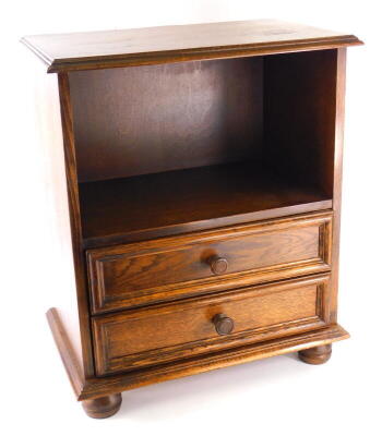 A reproduction oak cabinet, with drawers, 52cm wide.