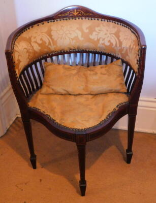 An Edwardian string inlaid marquetry and mahogany corner low chair, with damask upholstery, square taper legs with spade feet, 56cm wide.