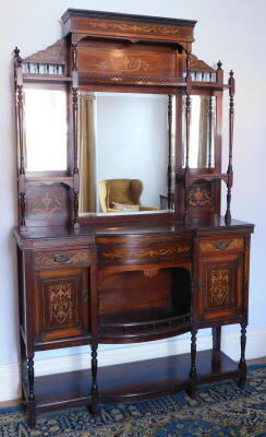 A late Victorian rosewood marquetry chiffonier, with an upper part with mirrors, panels, concave gallery, and turned uprights, the base with drawers, cupboards and central bow front galleried section, raised shelf to base on turned legs, 222cm high, 139cm