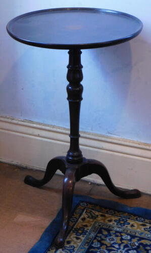 A 19thC tripod table, with dished top, 43cm diameter.