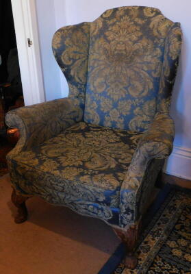 A wingback armchair, in George III style.