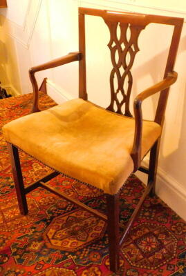 A 19thC mahogany carver chair, with pierced bar splat in the Chippendale manner, on square legs and plain stretchers.
