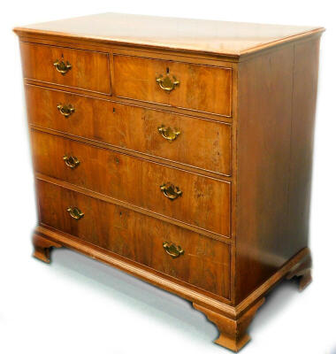 A 19thC flame mahogany chest, of three long and two short graduated drawers, with brass solid back plate handles, and ogee bracket feet, 111cm wide.