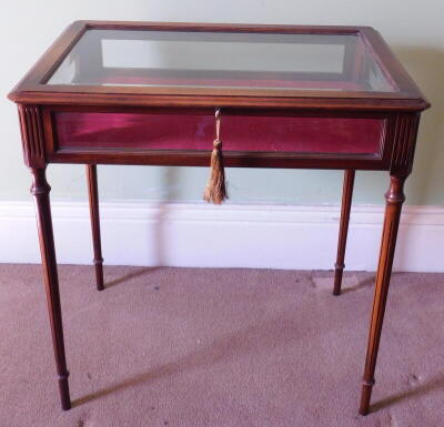 A Victorian style bijouterie cabinet, with bevel glazed panels and fluted taper turned legs, 72cm x 48cm.