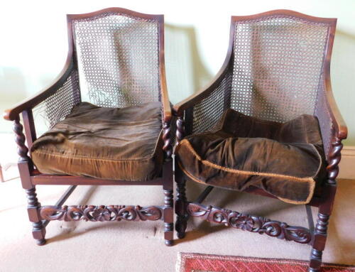 A pair of barley twist and bergere library chairs. (AF)