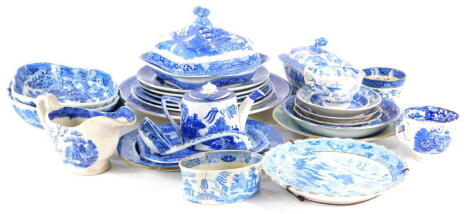 A collection of 19thC and later English pottery and porcelain, blue and white Willow pattern and other blue and white service china including a square tureen and cover, oval serving dishes, gravy boat, sauce tureen and cover, small teapot, plates, etc.