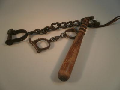 Two pairs of handcuffs and a beechwood truncheon