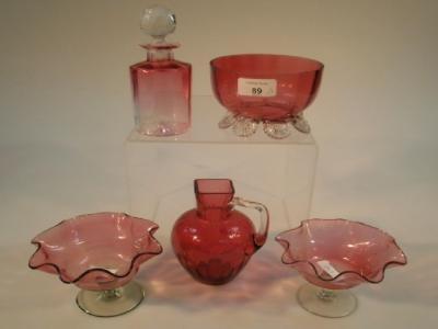 Five pieces of Victorian cranberry glass; a matched pair of flute edge