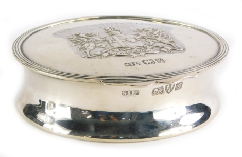 An Edward VII silver oval box, with hinged lid embossed decoration, The Hon The Irish Society, Chester 1907, 3.5oz.