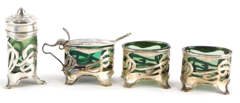 A silver mounted four piece Art Nouveau cruet set, with green glass liners.