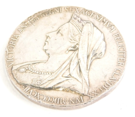 A Queen Victoria Diamond Jubilee commemorative medallion, in white coloured metal, with front and back profile, 6cm diameter.