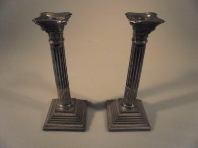 A pair of silver composite column candlesticks