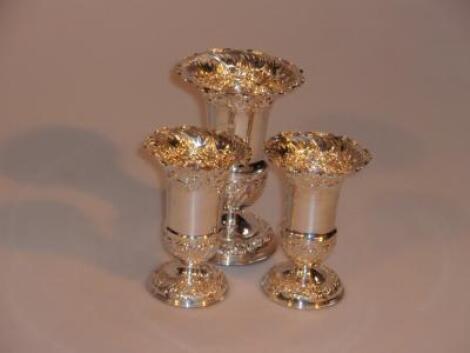 A Victorian silver garniture set of three pedestal vases by F B & Son Ltd