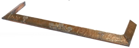 An early 20thC hammered copper Arts and Crafts fender, raised with a repeat pattern of stylised Lotus flowers, 135cm wide.