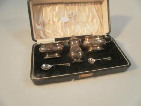 A George V silver condiment set by Adie Brothers