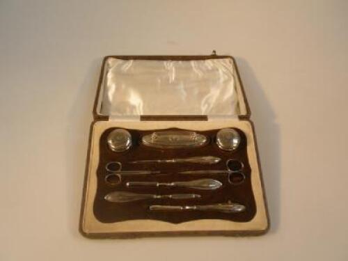 An early 20thC silver manicure set