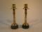 A pair of heavy brass candlesticks