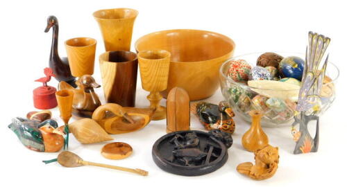 Various decorative items and effects, treen, heavily carved plaque decorated with a cobbler, 15cm wide, duck ornaments, various goblets, plain bowl, etc., (a quantity).