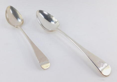 A George III Irish silver tablespoon, Old English pattern, with crest, and plain bowl, Samuel Neville, Dublin 1807, 21cm wide, together with a further George III silver Old English pattern tablespoon, initialled, with plain bowl, Peter, Anne & William Bat