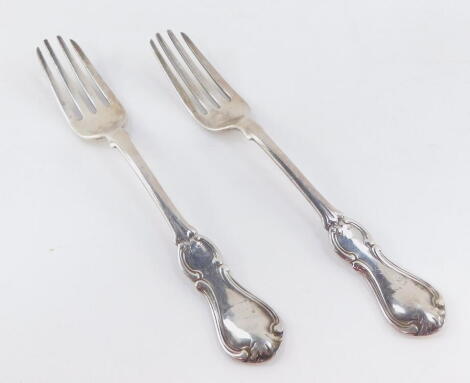 A pair of Victorian entree forks, decorated in the hourglass pattern, crest engraved, John James Whiting, London 1852, 17cm wide, 3oz.
