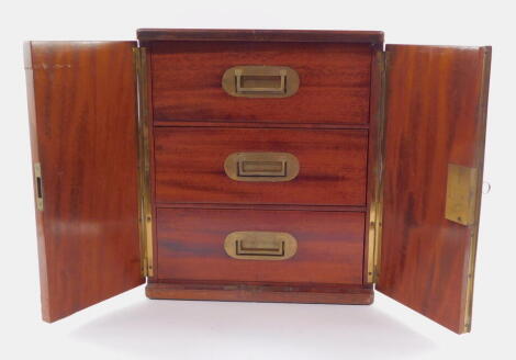A 19thC mahogany campaign travel box, of rectangular section, the hinged front revealing three drawers, each with flush brass handles, with a fitted interior, on a plain base, 47cm high, 30cm wide, 27cm deep.