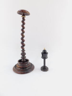 Two 19thC sewing aids, comprising an ebonised bobbin holder, with bone acorn finial and removable top, on a circular studded base, 13cm high, and a turned bobbin stand with compressed mushroom top, tapering removable barley twist stem and shaped base. - 2