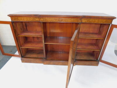 A Victorian figured and burr walnut veneered breakfront credenza, with mahogany cross banded and string inlaid top, Arabesque marquetry frieze, over a central panelled door with quarter veneers flanked by glazed cross banding glazed doors and plinth base, - 8