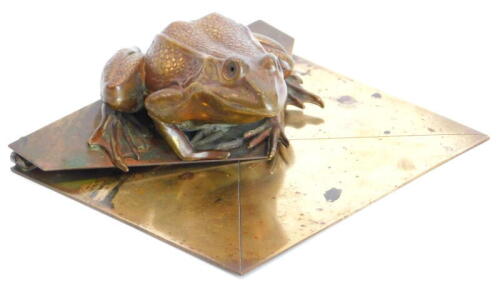 An unusual Victorian brass novelty desk clip modelled in the form of a toad, seated on an envelope, 13.5cm x 11cm.