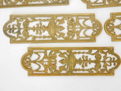 A set of thirteen late 19thC gilt brass door finger plates, each pierced and cast in urns, pattern and foliate scrolls, 24cm high, 7cm wide. - 2
