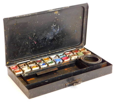 A late 19thC toleware artist's paint box, the hinged lid later written 'Tea' four times, enclosing twenty contemporary ceramic pots for paint etc., 25cm x 14cm.