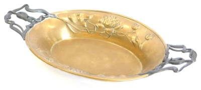 A continental Art Nouveau brass and pewter two handled dish, embossed and cast with lilies and tulips in the manner of WMF, 42cm wide.