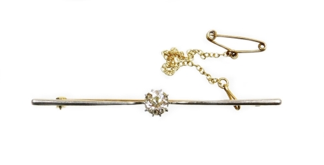 A diamond set bar brooch, the central old cut stone in claw setting, 5.8mm x 5.4mm x 4.2mm, totalling approx 0.64cts, in a white metal setting on a yellow metal single pin back, with safety chain, stamped 15ct plat, 6.5cm wide, 5g all in, in a Fowler and 