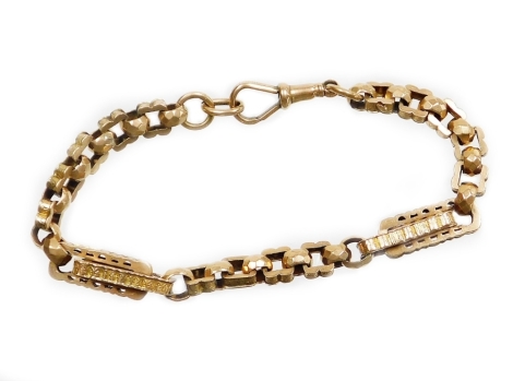 An elaborate design bracelet, previously converted from a watch chain, with various embossed and hammered loop design, with a clip clasp, yellow metal stamped 9ct, 21cm long overall, 15.1g.