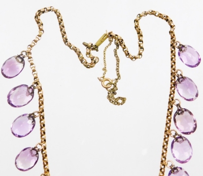 An Edwardian design amethyst graduated beaded necklace, set with twenty two oval cut amethysts, on a curb link chain, yellow metal, unmarked, with replacement and plated clasp, 48cm long overall, the largest bead 15mm, 37.6g all in. - 3