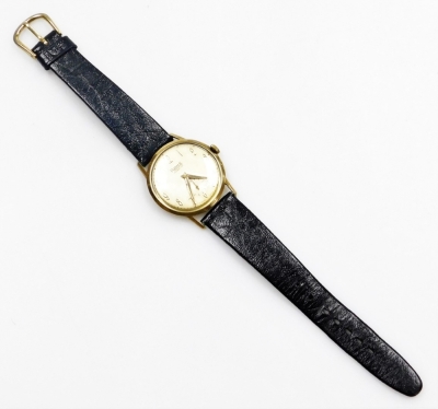 A Rone gentleman's wristwatch, with silver coloured dial, in a yellow metal casing, unmarked, on a later black leather strap with gold plated end, the watch head 3.5cm wide, and the watch 23cm high overall. - 3