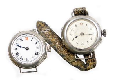 Two silver cased wristwatches, to include one with white enamel dial, gold marker points, with a Swiss movement stamped 925, lacking glass, another with silvered coloured dial, and bearing the inscription Margaret A Gray, makers stamp CN, with Swiss movem