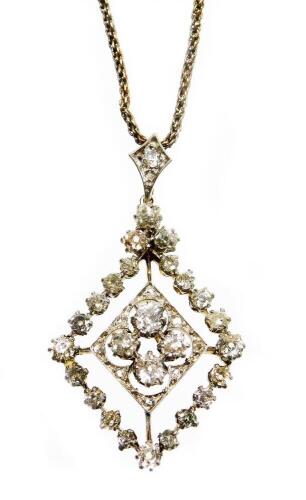 A Victorian/Edwardian diamond pendant, the lozenge shaped pendant set with rose cut diamonds, of varying size, the centre section approx 0.42cts, surrounded by sixteen smaller diamonds each approx 0.05cts, with larger diamond to each point and three to th