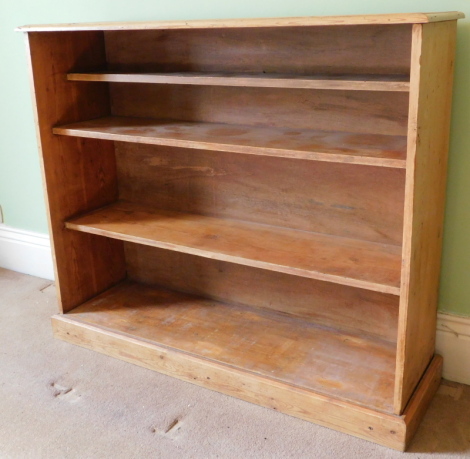 A Victorian stripped pine open bookcase, 107cm high, 126cm wide.