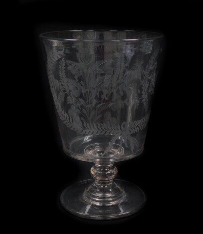A Victorian cut glass vase, the bucket shaped bowl engraved with thistles, shamrock and a wreath enclosed monogram, raised on a single knop stem, over a conical foot, 25.5cm high.
