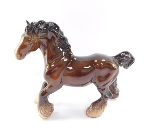 A Beswick pottery cantering Shire Horse, in brown, black and white colourway, printed marks beneath, 23cm high.