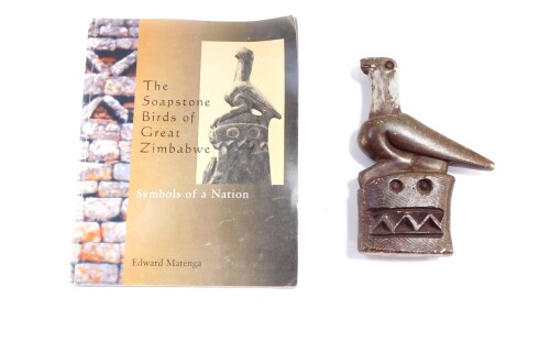 A 20thC Zimbabwe soapstone bird ornament, 19cm high, and Matenga (Edward). Soapstone birds of Zimbabwe book, (AF). (2)