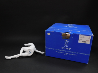 A Kaiser white matt bisque porcelain figure, modelled reclining, no 273., printed and impressed marks, boxed. - 3