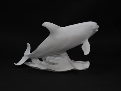 A Kaiser white matt bisque porcelain figure, modelled as a Killer Whale, no 579., printed and impressed marks, boxed. - 2