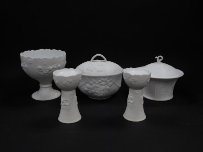 A group of Kaiser parian porcelain wares, comprising a pedestal dish, 17cm high., box and cover, 20cm high., and another, 17.5cm diameter, together with a pair of candle holders, 15cm high. (5)