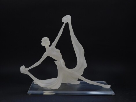 An Art Deco style fibre glass figure of a dancer, modelled in a mannerist, elongated standing pose, holding the hems of her skirt, raised on a clear rectangular bevelled base, 48cm wide.