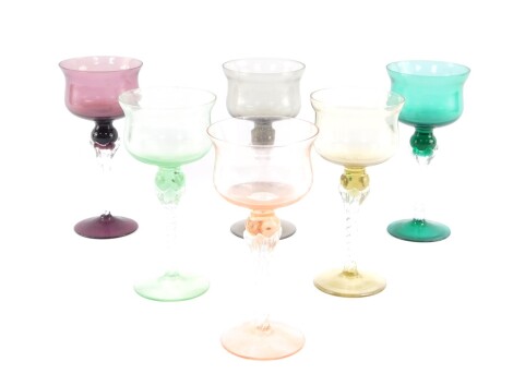 A harlequin set of mid century coloured wine glasses, raised on spiral twist stems. (6)