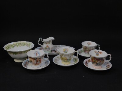 A set of four Royal Doulton Brambly Hedge Four Seasons tea cups and saucers, together with a cream jug, sugar bowl, spoon dish and an oval dish. (12)