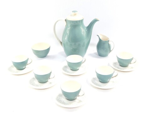 A Royal Doulton pottery part coffee service decorated in the Tracery pattern, comprising coffee pot, cream jug, six cups and saucers.